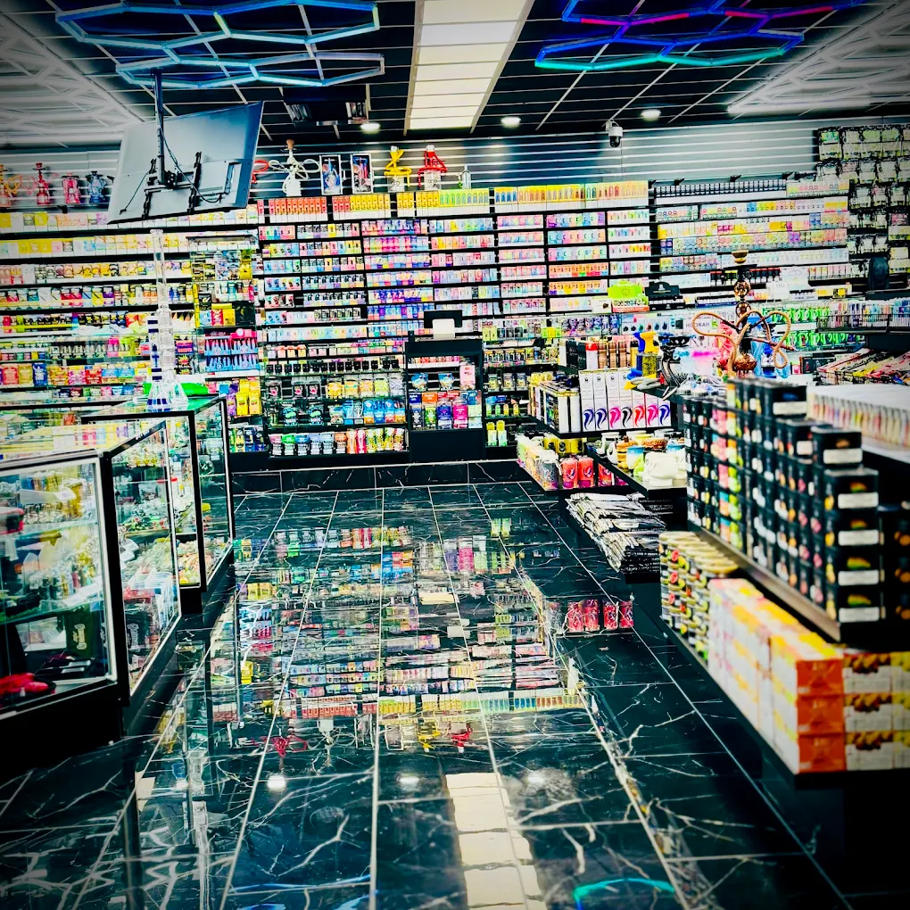 EZ Smoke House Hampton VA interior aisle with marble floors and stocked vape and tobacco shelves